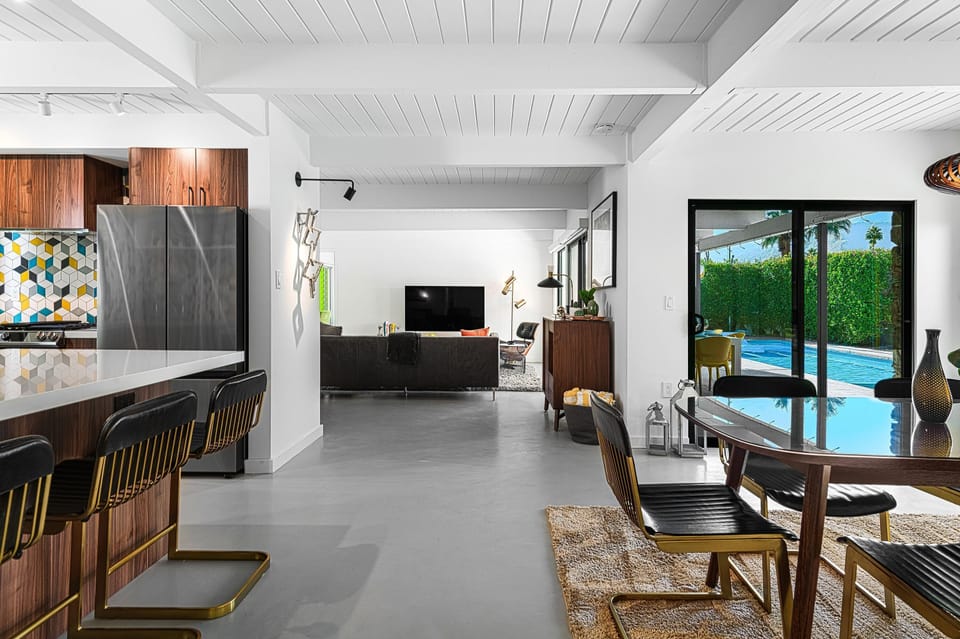 Sleek concrete floors and cool white palette throughout the home