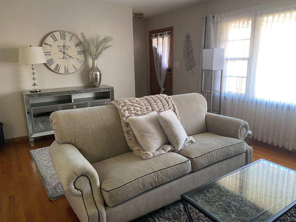 Living Room with front closet, extra seating, fans, blankets
