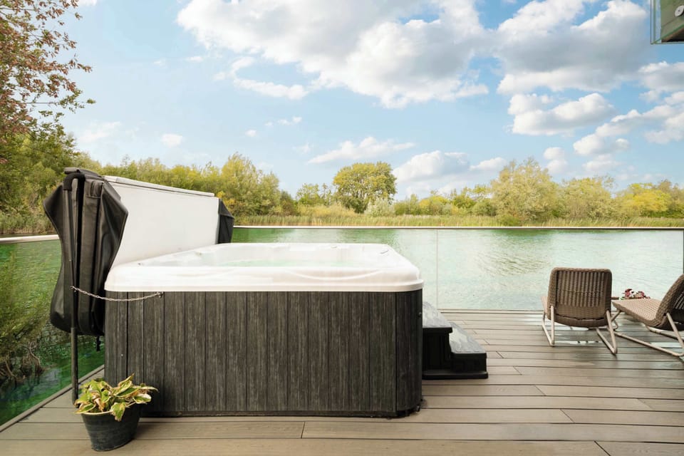 Hot tub on private decking with lake views