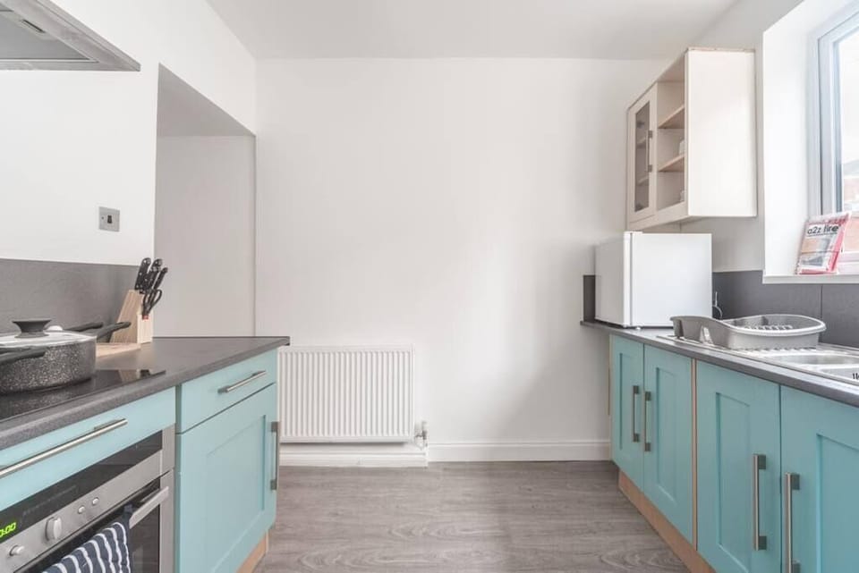 Modern kitchen area, equipped for culinary adventures and casual gatherings.