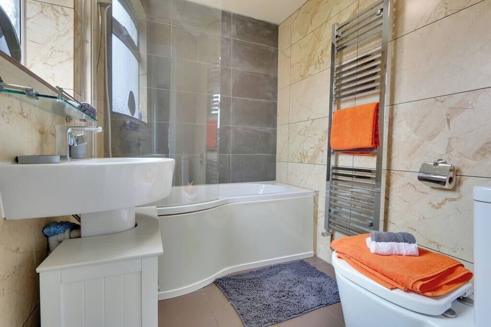 Bathroom with shower over bath