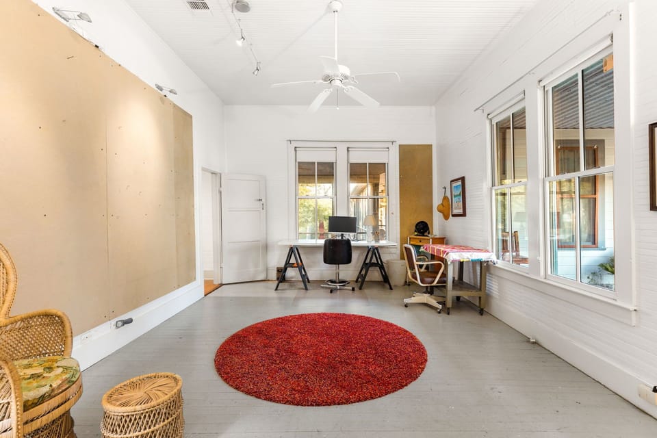 Home office setup with large screen in Bedroom 2