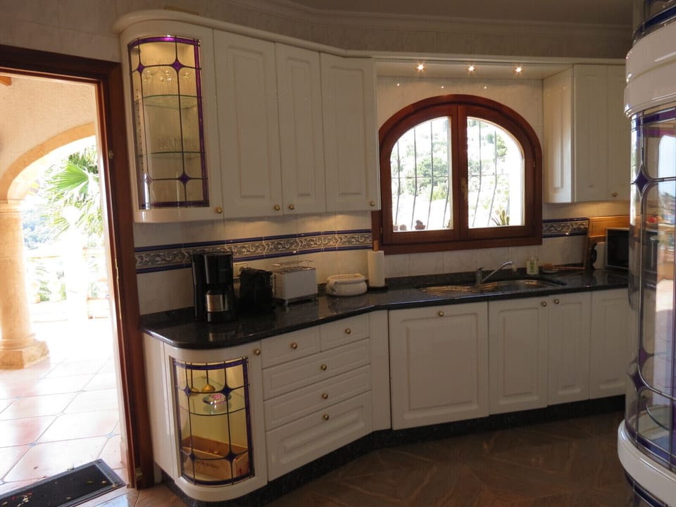 Kitchen with direct access to the main terrace—ideal for al fresco meals.