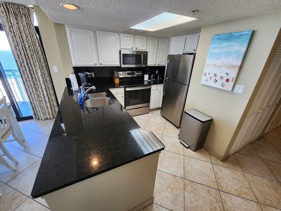 The kitchen and refrigerator.