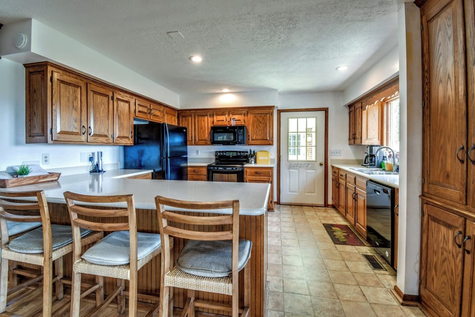 Kitchen with door to covered breezeway and patio.