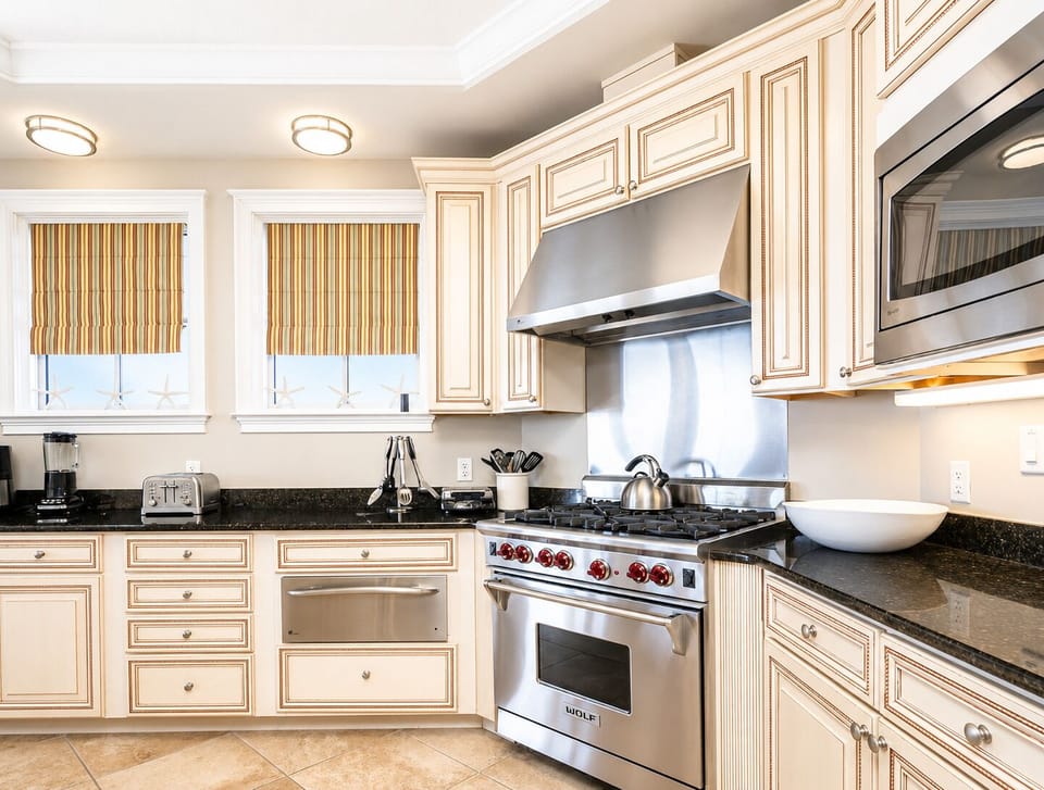 Step into your fully equipped gourmet kitchen with professional-grade stainless steel appliances, granite countertops, and custom cabinetry—everything you need to cook like you're at home.
