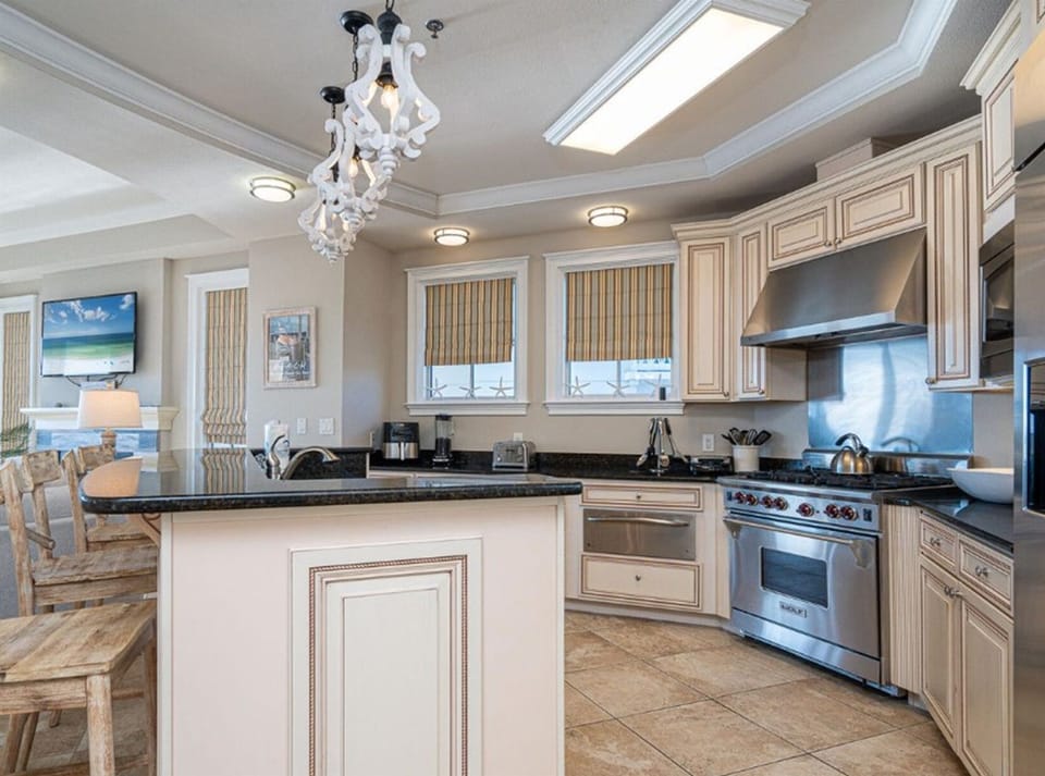 Step into your gourmet kitchen where gleaming granite counters and premium appliances await your culinary adventures.