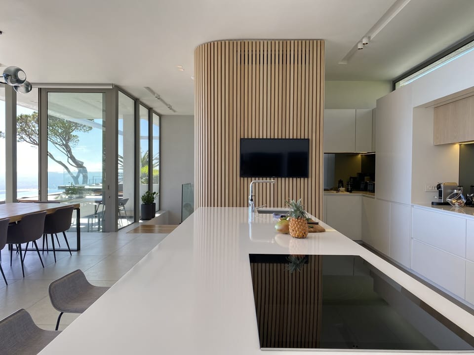 Kitchen island with view of hidden prep area
