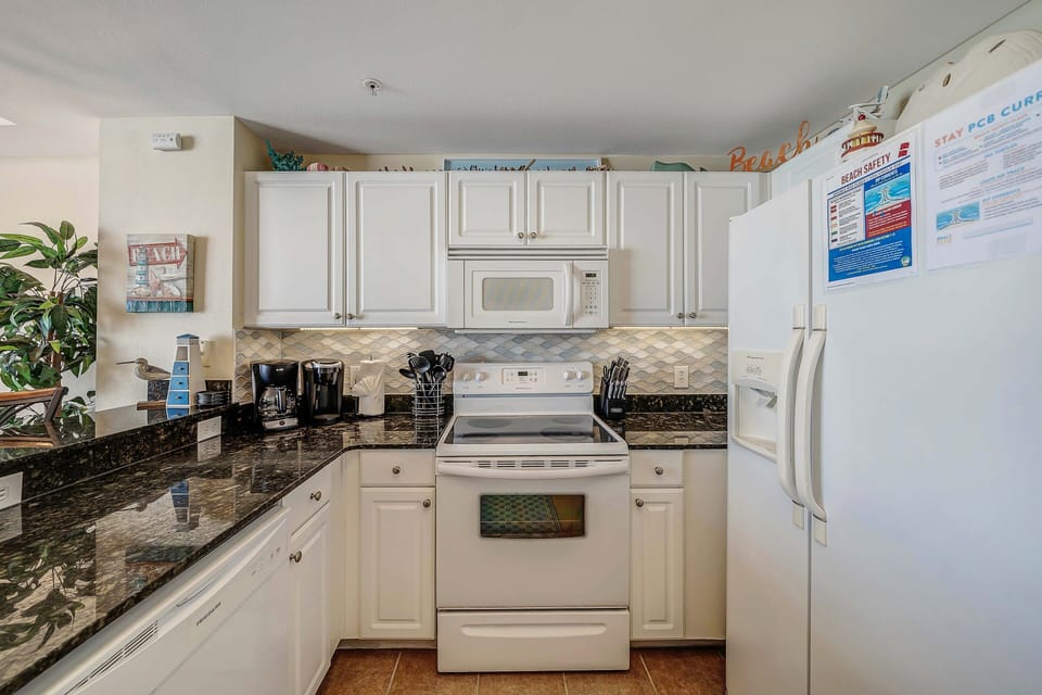 The fully equipped kitchen features granite countertops and has everything you need to cook meals for family & friends.