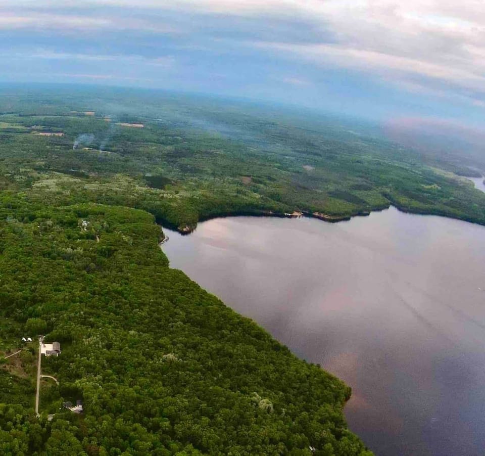 very high aerial view. Home is visible in lower left hand corner.