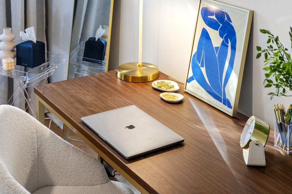Craft an elegant dedicated workspace by combining sleek furniture