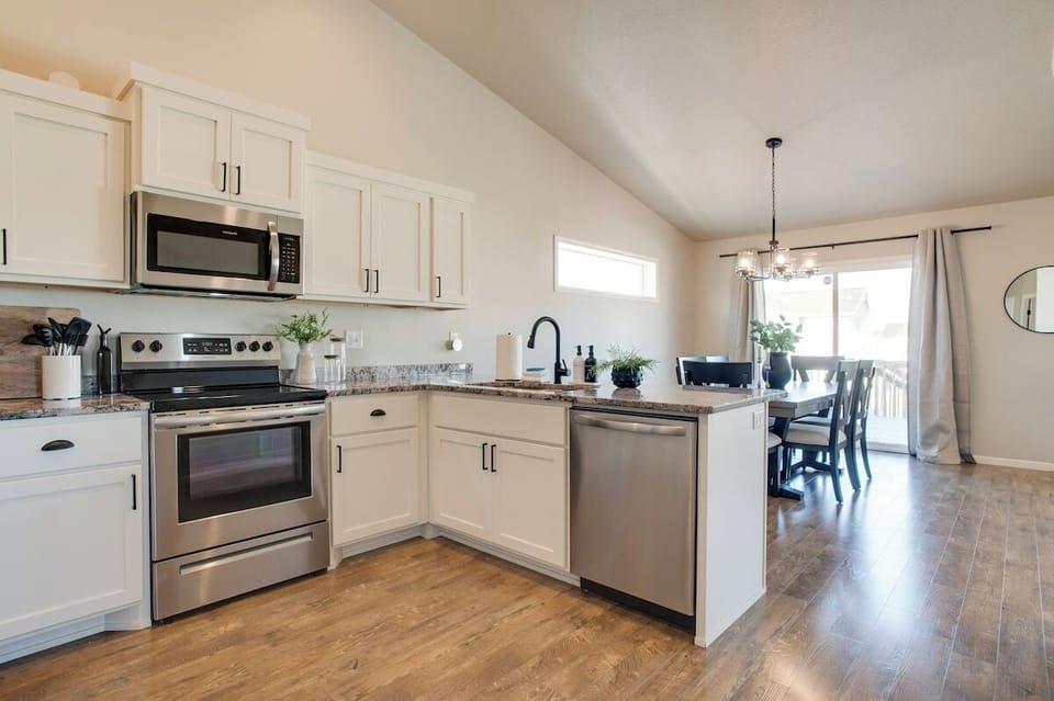 Open-concept kitchen into dining room.