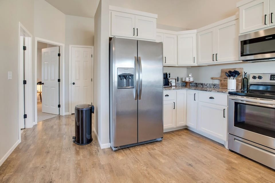 Fully stocked kitchen designed to accommodate up to 8 guests, featuring all the essentials for convenient meal preparation and dining.