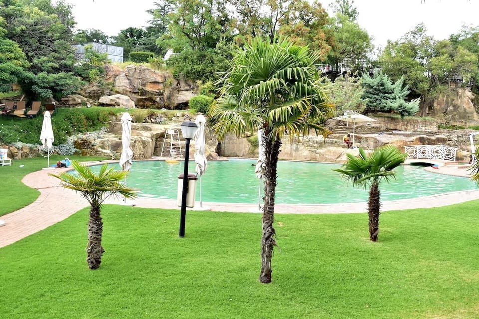 Lounge on cushioned sunbeds and savor warm garden breezes.