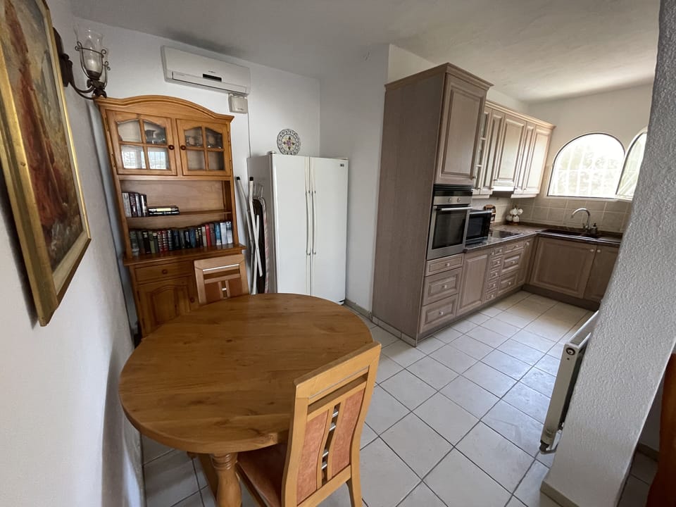 Dining area and kitchenette - pool level apartment.