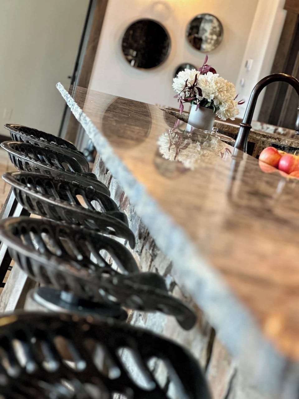Tractor seat countertop barstools add to the decor of the house.