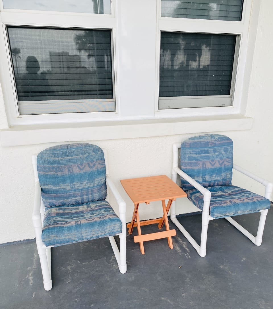 Condo sitting area outside door.