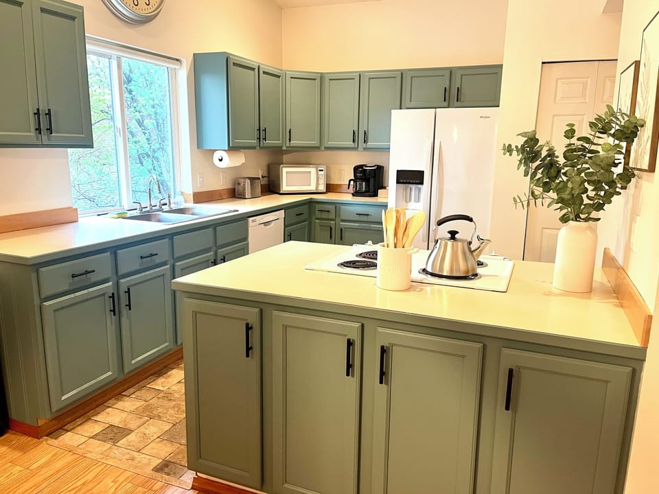 Well stocked kitchen with basic spices and cooking oils.