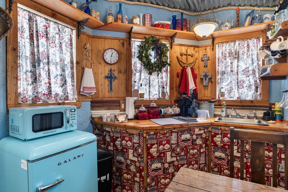 The microwave and mini-fridge evoke a vintage era while offering modern utility!