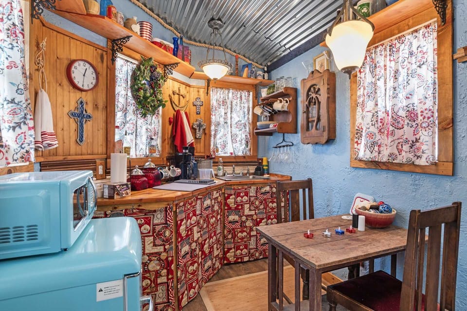 Your colorful kitchenette corner includes a hot plate, microwave, mini-fridge, and K-Cup coffee maker.