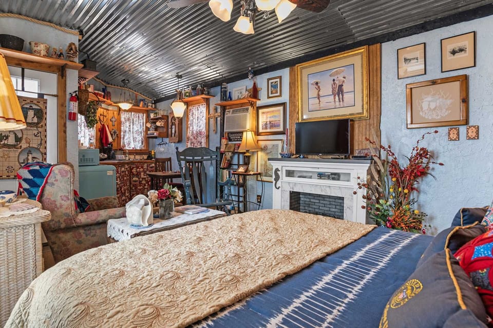 Clean and comfortable complementary linens on the queen-sized bed help assure restful nights!