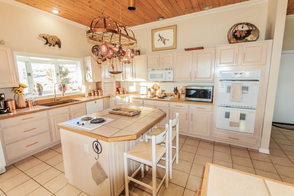 Chef's kitchen features double wall ovens, two range tops, even two islands for seating