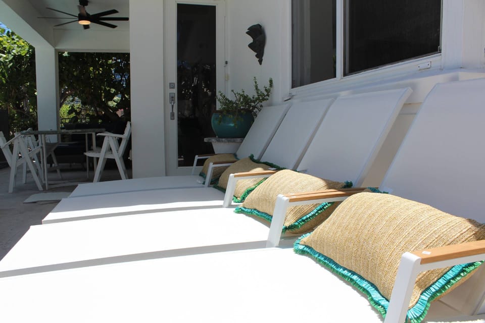 Lounge by the pool sipping on a cold beverage