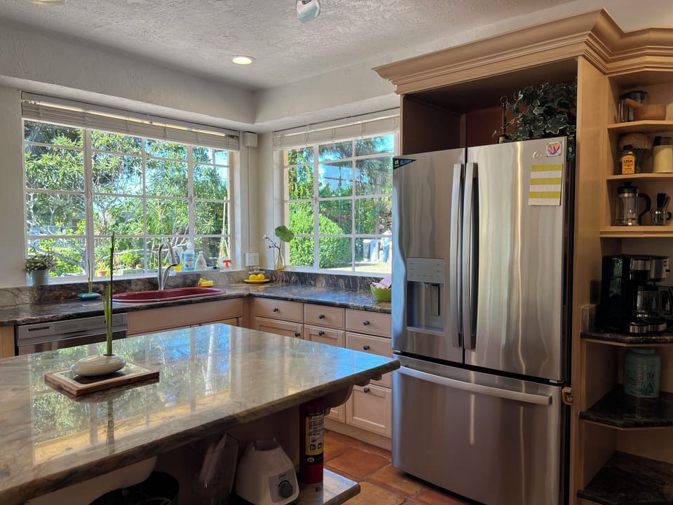 Kitchen windows facing pool.
