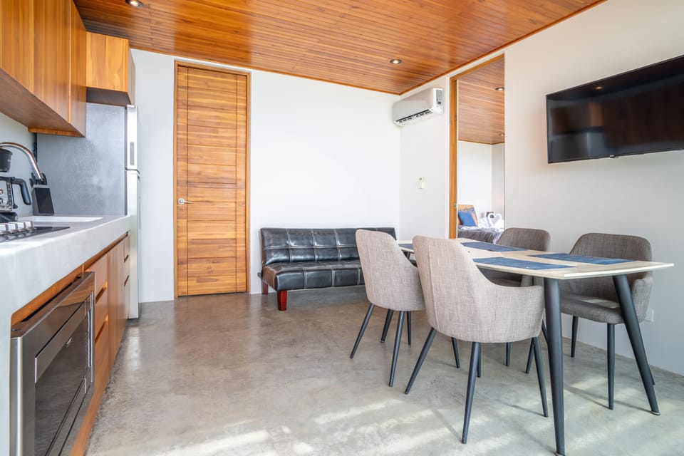 A stylish open-plan living and dining space designed for comfort and connection.