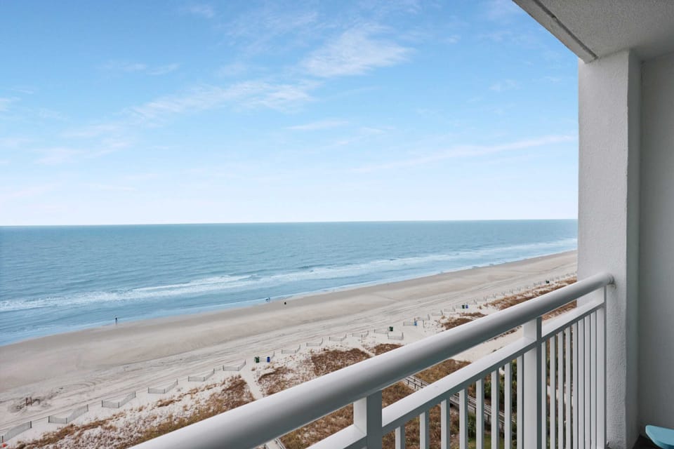 Enjoy breathtaking ocean views from your private balcony, just steps from the sandy beach. Perfect for relaxing mornings and sunset strolls. Book your coastal getaway today and make unforgettable memories by the sea!