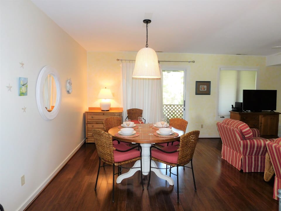 Kitchen/Dining Transition - The home features a six-room layout designed with an open-concept first floor that integrates the kitchen, dining, and living areas.