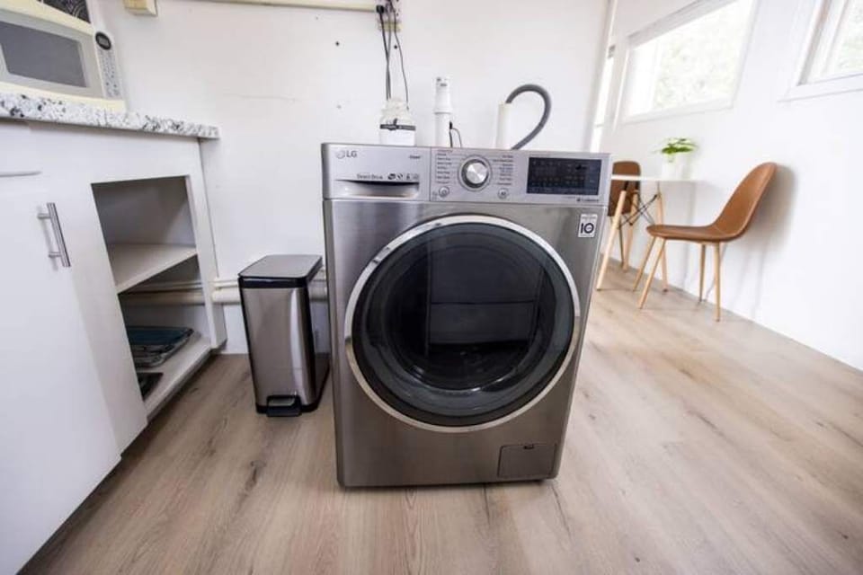 The combination washer/dryer can handle small loads. Additional hangers for drying are available in the closet. Detergent is provided for your first few loads.