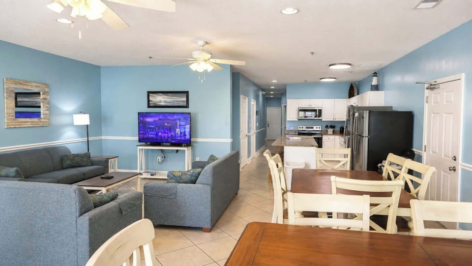 Living and dining flow together, with the kitchen and balcony just steps away.