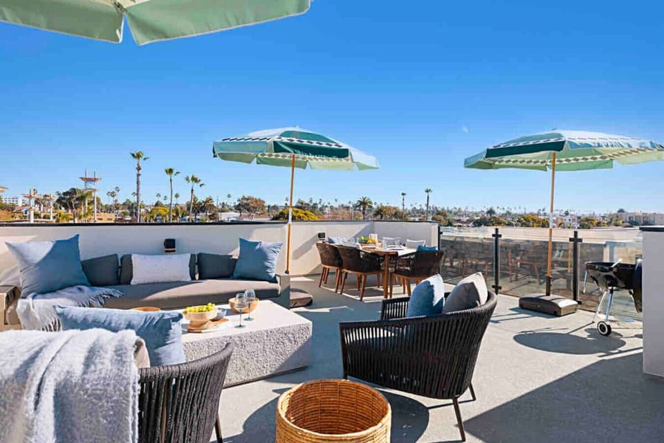 `Oceanfront Oceanside beach rental with direct beach access, private sandy yard, fire pit, ocean views, walk to Oceanside Pier, restaurants, coffee shops, Seabird Hotel, Mission Pacific Hotel, family-friendly, pet-friendly, sleeps 8
