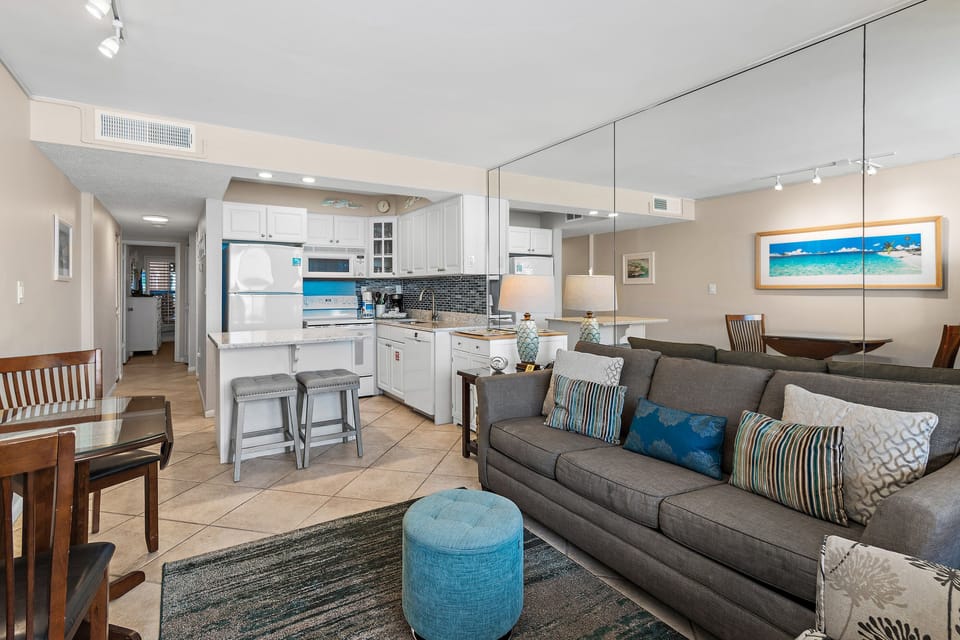 Your bright open-plan space flows seamlessly from kitchen to living room, where you'll love the coastal touches and modern comfort.
