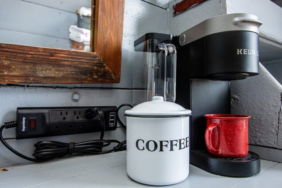 A few upgrades have been made to ensure your comfort, this includes a Keurig coffee maker with tea and coffee provided, as well as a power strip where you can recharge!
