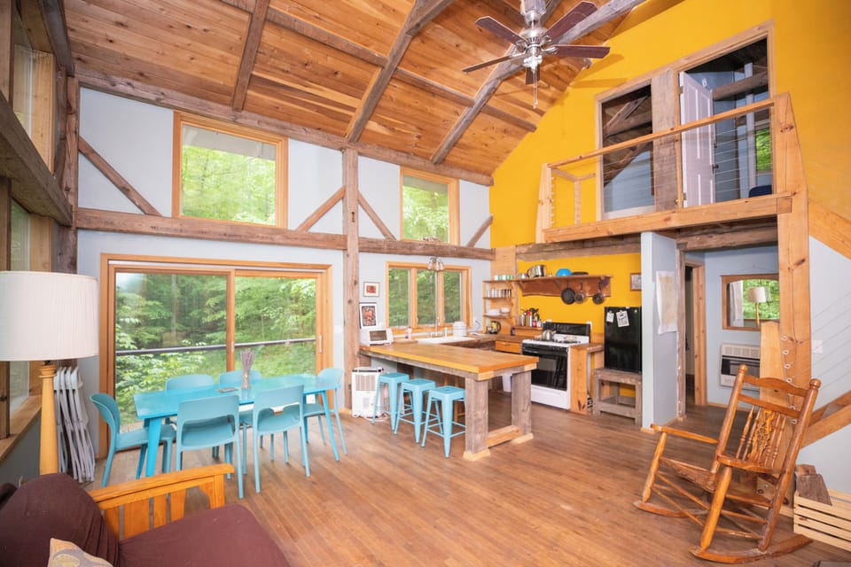A view of the kitchen and dining room and upstairs.