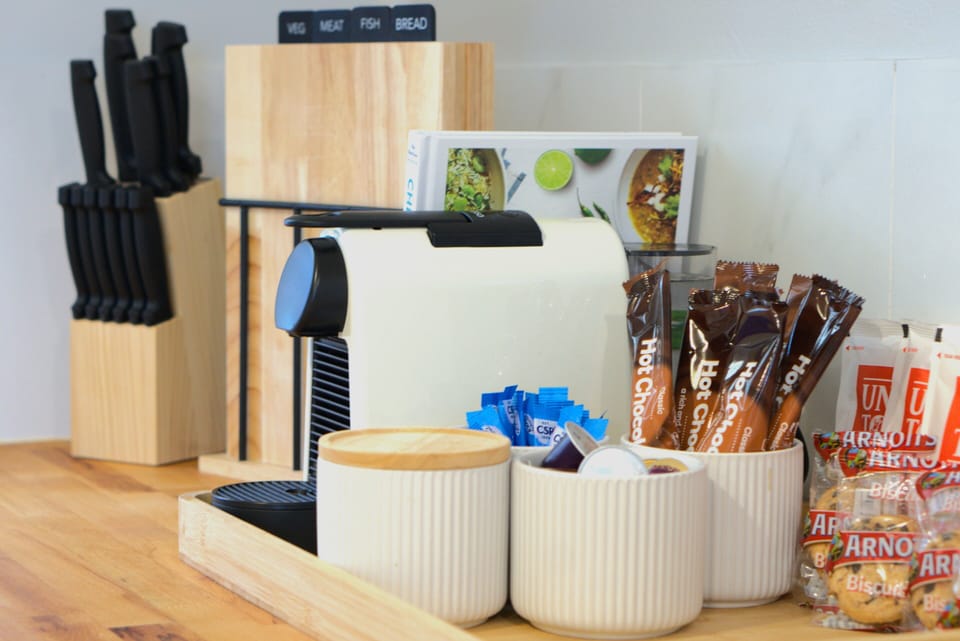 Complimentary coffee, biscuits, and fresh milk.