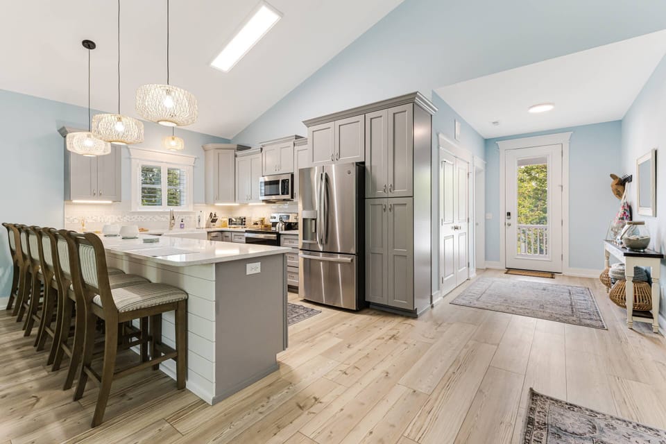 Start your day right! Our kitchen with a breakfast bar offers the perfect spot to enjoy your morning coffee and plan your adventures.