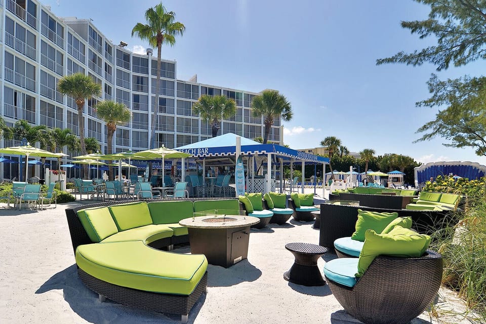 Unwind on plush loungers steps from the beach bar.