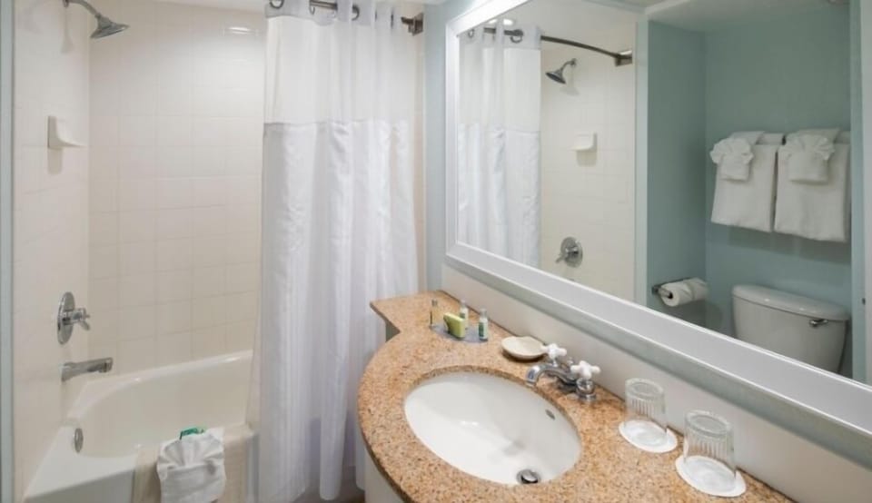 Refresh easily with a spotless bath and bright vanity.