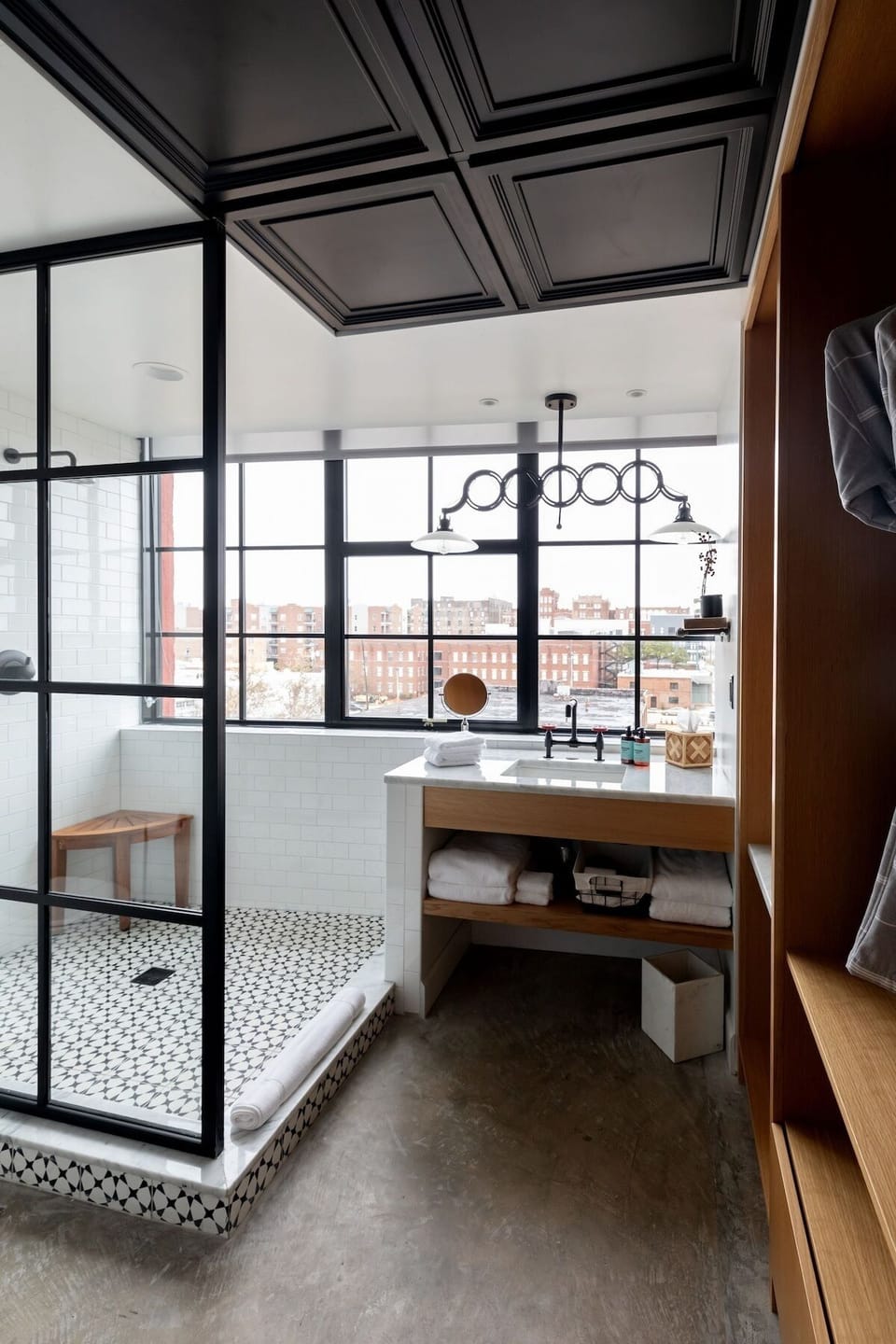 Refresh in a glass-walled shower with skyline views.