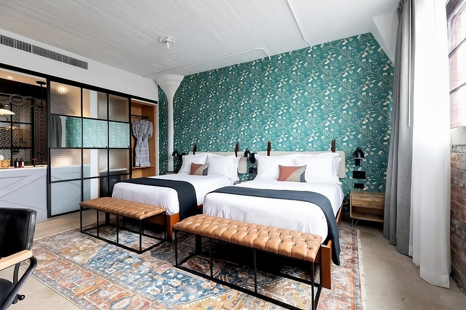Stretch out on crisp twin beds in a stylish loft.