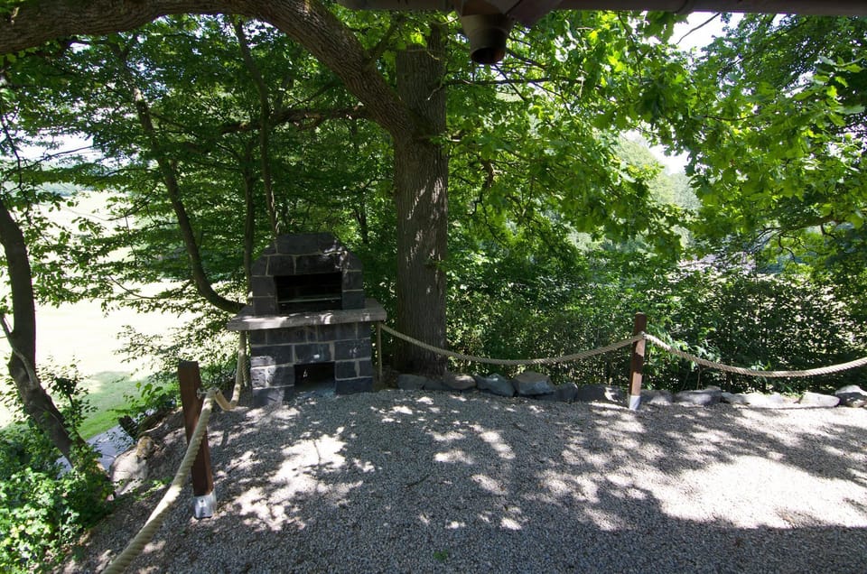 The rustic grill behind the holiday home.