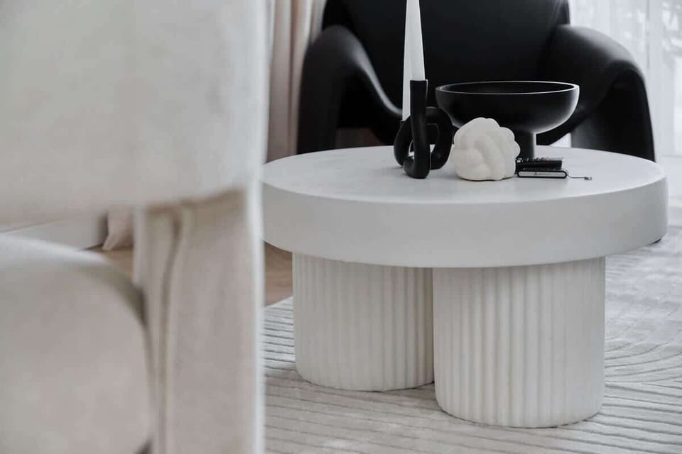 Close-up of a modern coffee table with minimalist decorative items.
