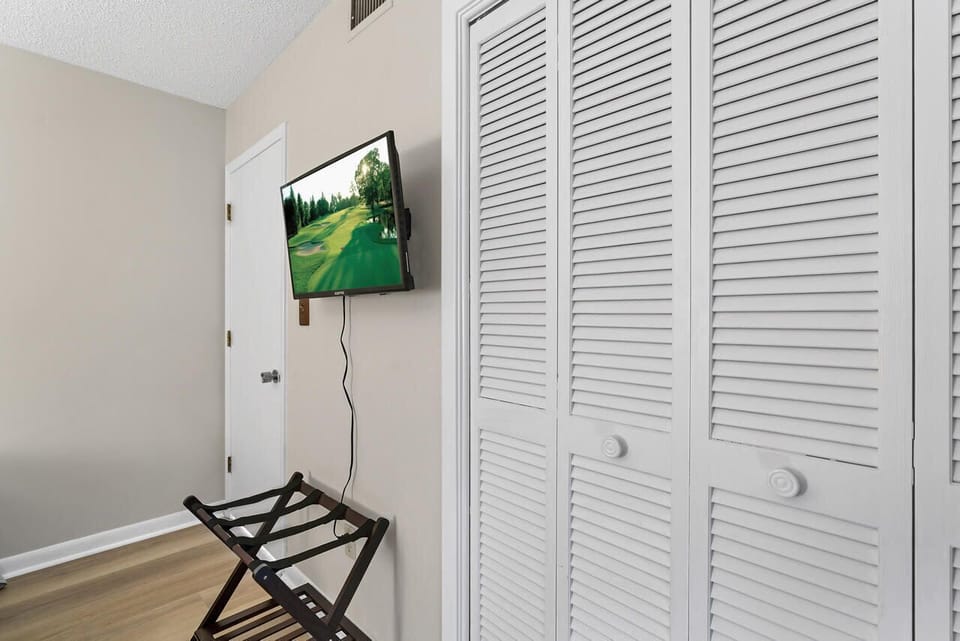 Room #1 with flat screen and closet