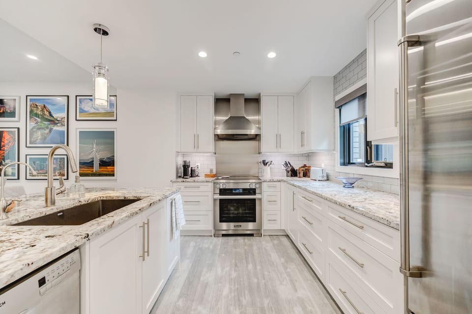 Kitchen with stainless steel appliances. SubZero fridge & Miele convection oven.