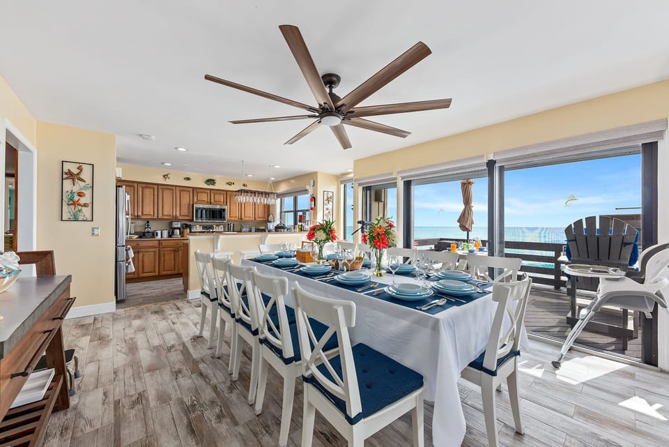 Oceanfront dining area seats 16+ w/ raised bar seats, plus outdoor dining