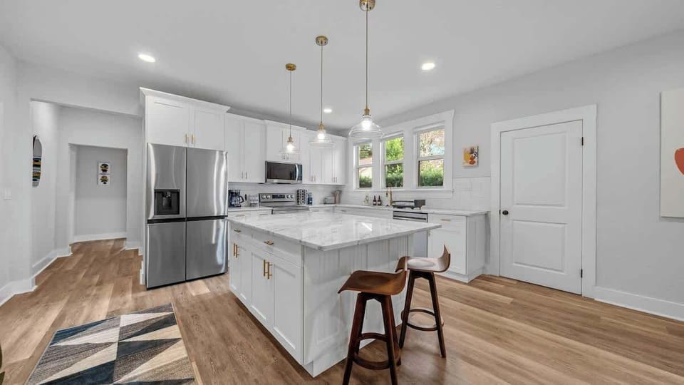 Spacious chef’s kitchen with an expansive island - perfect for whipping up meals, entertaining, and making memories