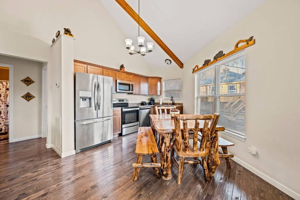 Dining table and fully equipped kitchen.